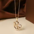 Golden titanium steel heart necklace with zircon inlay and artistic MG letters - Rose Gold Heart Necklace N0454R