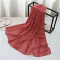 Detail of brick red chiffon scarf with fine rolled edge draped on a geometric metal rack - 175cmx70cm / Orange Brown