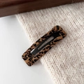 Detailed view of rectangle leopard print hair clip on a minimalist textured surface - Coffee Leopard - Square