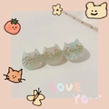 Detail shot of three cute cat-shaped hair clips with green marble texture and gold accents - Aqua Green Cat
