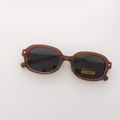 Gafas de sol polarizadas plegables con montura marrón translúcida y lentes gris oscuro - Marrón