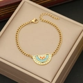 Goldene fächerförmige Halskette mit blauen und orangen Kristallen in Schmuckbox - Armband