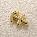 Macro shot of 18K gold-plated Sagittarius zodiac bubble pendant with metallic texture - Sagittarius