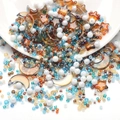 DIY bead set with blue and amber glass stars, moon pendants and white imitation pearls - Blue Green Orange Gradient