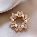 Macro detail of a 14k gold plated wreath brooch with pearls and sparkling rhinestones - 30# Gold - Real Gold Plated