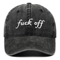 Macro shot of white script embroidery on distressed black-gray washed denim baseball cap - Black