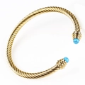 Golden titanium steel cable cuff bracelet with blue turquoise stone beads - Gold - Synthetic Turquoise
