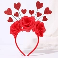 Detail of red fabric roses and glitter heart ornaments on a festive Valentine headband - 10 Hearts + Large Cloth Flower