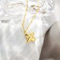 Detailed close-up of a minimalist 18K gold-plated balloon X pendant on a delicate bead chain - Pendant Only (Without Chain) / Letter X