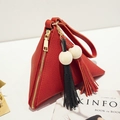 Red triangular leather wallet with dual tassels and wooden beads on a white surface - Cherry Red