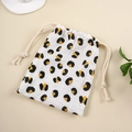 Detail of drawstring storage bag in white muslin cotton with leopard print and cotton rope - Leopard Print