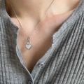 S925 sterling silver heart necklace with white mother-of-pearl inlay on a model - 925 Sterling Silver / Platinum (White Mother of Pearl)