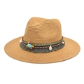 Close-up of woven fedora hat with ethnic beaded band, turquoise stone and grey tassels - Camel