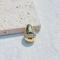 Water drop gold pendant with micro-pasted zircons on a textured stone surface - Tapered Baguette Zirconia Style / Gold
