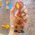 Brown capybara mini cube keychain with a mechanical wind-up knob and lobster clasp - Wind-up Capybara - Brown Black