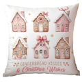 Detail of gingerbread house pattern and Christmas wishes text on a white festive pillowcase - Gingerbread Kisses