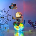Astronaut building block pen holder with glowing LED lights and micro brick earth base - 6906 Earth Holding Astronaut with Light