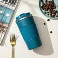 Dark teal insulated stainless steel coffee mug with silicone sleeve on white table - 380ml / Gen 3 with Silicone Sleeve / Blue