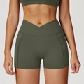 Olive green high-waisted yoga shorts with V-cross waistband and side pockets - Cedar Green