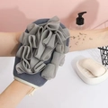 Exfoliating bath glove in dark gray with mesh texture and white hanging loop - Gray