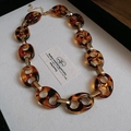 Detail of leopard print resin chain link necklace with gold metal accents and U-shaped rings - Amber Leopard Splicing Style (HE23494HN7762HB3258)
