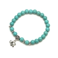 Boheems turquoise kralenarmband met een zilveren olifant hanger op een witte achtergrond - Olifant 1