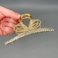 Elegant gold bow-shaped hair claw clip with sparkling rhinestones in a polished alloy finish - Straight Ribbon Rhinestone