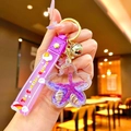 Purple unicorn liquid star keychain with glitter quicksand and silicone strap charm - Purple Ocean Petals