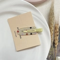 Fermaglio per capelli giallo con pois colorati e base glitter su carta elegante - Crema Bobo