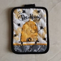 Thick cotton Bee Happy baking mat with hive pattern and black hanging loop trim - Bee