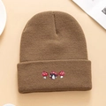 Brown knitted beanie with three embroidered mushrooms on a minimalist beige background - Khaki