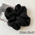 Elegant 13cm black satin scrunchie with a silky smooth finish and ruffled design - 13cm / Black