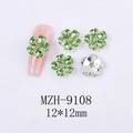 Macro view of green crystal clover nail art charms with silver backing and 12mm sizing - Five-Petal Flower Fruit Green Style (9108)