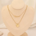 Dettaglio di una collana dorata a strati con ciondolo Forever e un cuore pendente - Stile Cuore con Scritta Forever (9#)