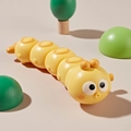 Giocattolo a molla a forma di bruco giallo con viso carino e motivi circolari arancioni - Bruco / Giallo