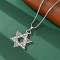 Close-up of Star of David pendant with vintage textured engraving on silver chain - Star of David Pendant