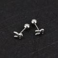 Detailed macro view of 16g stainless steel bunny ear studs with screw ball backings - Rabbit / Steel