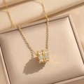 Titanium steel cylinder necklace with zircons displayed in a champagne gold jewelry box - Gold