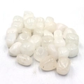 Macro shot of natural tumbled white crystal stones with polished irregular surfaces - White Crystal