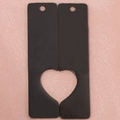 Macro view of black rectangular metal pendants with hollowed heart-shaped cutout - Black (One Set)
