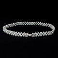 Detail of double-strand pearl waist chain featuring a sparkling rhinestone bow buckle - White Bow Rhinestone Buckle (Style 16)