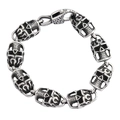 Gothic punk skull link bracelet with oxidized finish and secure clasp on white backdrop - Skull Nine / Silver