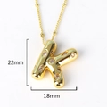 Close-up of golden letter K pendant with rhinestones showing 22mm by 18mm dimensions - Letter K(XED218)