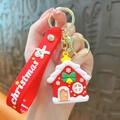 Festive red Christmas house silicone keychain with strap and gingerbread man charm - Christmas House