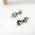 Macro detail of retro silver Vajra Bell and Phurba pendants for Buddhist jewelry DIY - Silver Ritual Tool Components (18# Pair) / 1 Pair Pack / Silver
