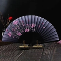 Detailed view of silk folding fan with pink cherry blossoms and butterfly pattern - Ink Butterfly Flowers