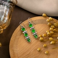 Close-up of vintage silver bohemian earrings with emerald green tiered square and pear gems - E5854-Silver Retro Multi-Square Green Diamond