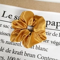 Elegant gold satin silk oversized scrunchie with glossy pleated texture on a white background - Satin Mustard Yellow
