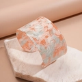 Detail of wide resin cuff bracelet with pink and blue marble pattern on beige stone - Pink Abstract Cloud