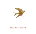 Macro detail of retro gold swallow wall decor with intricate feather textures, small size - Small